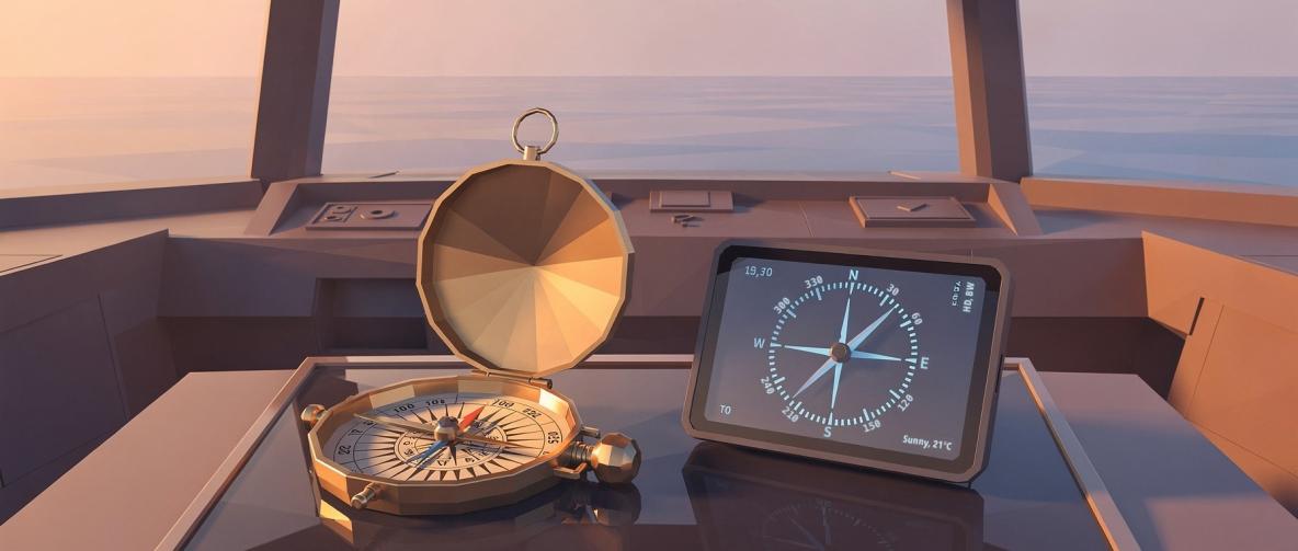 Alter Kompass und moderner Navigationsbildschirm in einem Schiff mit Blick auf das Meer.